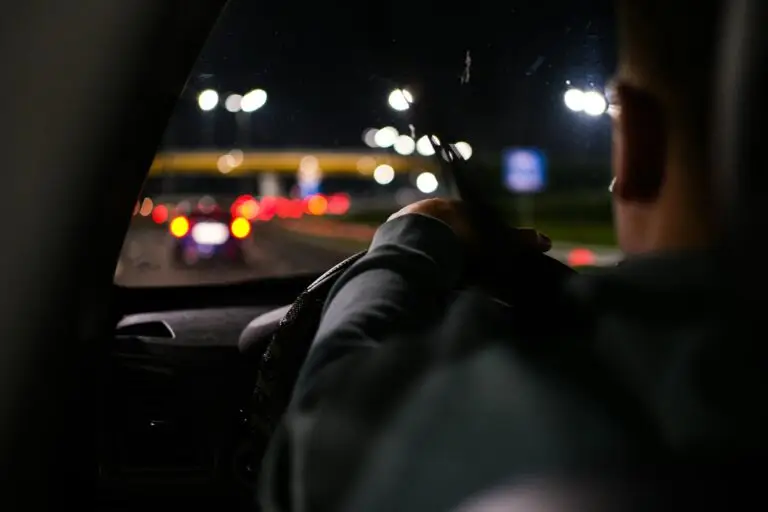 man-driving-a-car-at-night